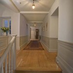 The first floor landing in peaceful, muted tones and with a stunning oak floor