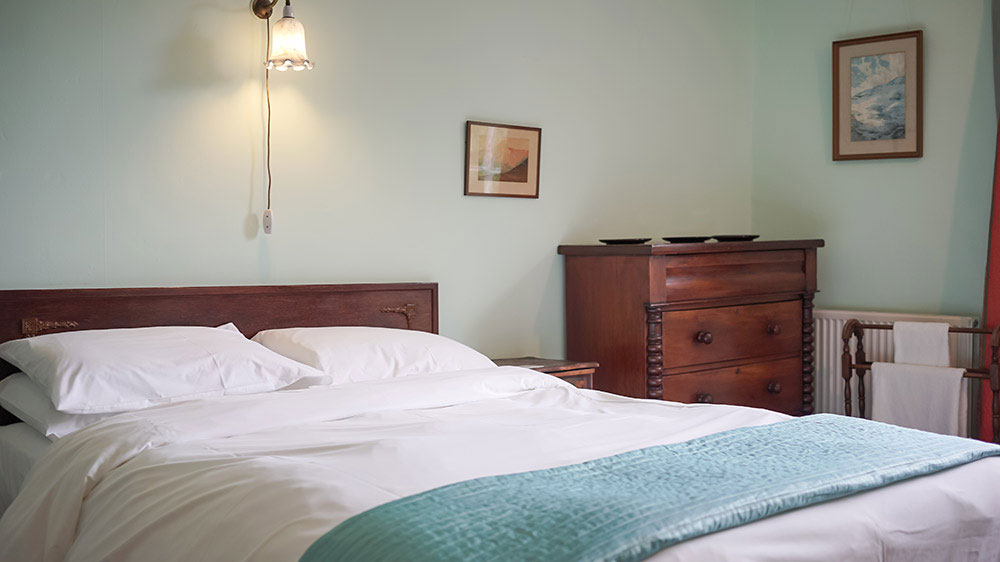 This bedroom at Tone Dale House, Somerset has a large double bed and views of the garden.