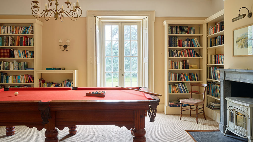 The snooker table is three quarter size. There's a piano and lots of books too