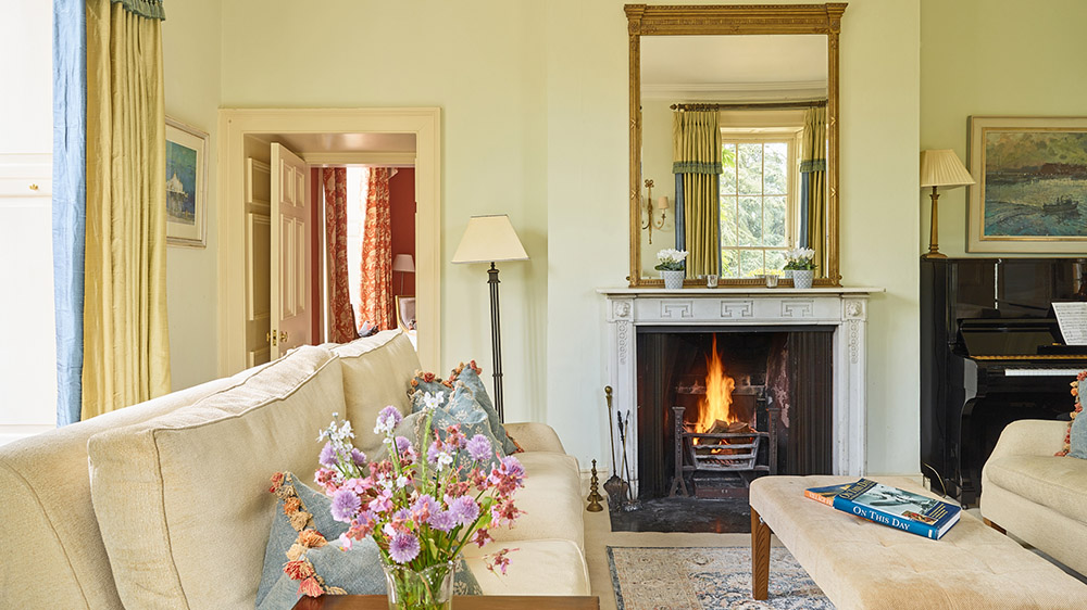 Somerset Manor has several sitting rooms, this one with a log fireplace