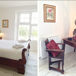 This light filled bedroom at Devon Farmhouse has a charming roll top bed and beautiful antique furniture