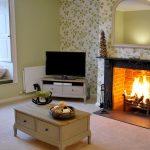 The sitting room with the log fire burning for a cosy atmosphere at a friends reunion