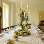 The dining room at Somerset Manor has a large antique table that comfortably seats all your big group.