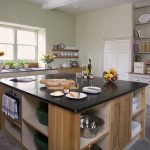 The kitchen at Berry House has a large central island, a farmhouse style dresser and plenty of equipment for a large party