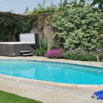 The outdoor heated pool and hot tub at Somerset Manor, available through The Big House Company