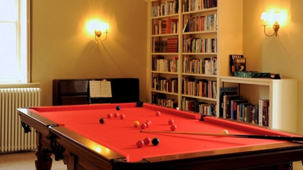 The snooker table is three quarter size, there's a piano and lots of books too.
