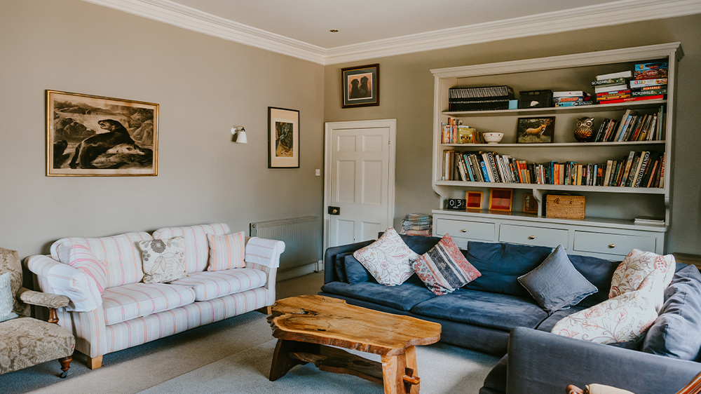 Chose a book from the shelves and curl up on the sofa