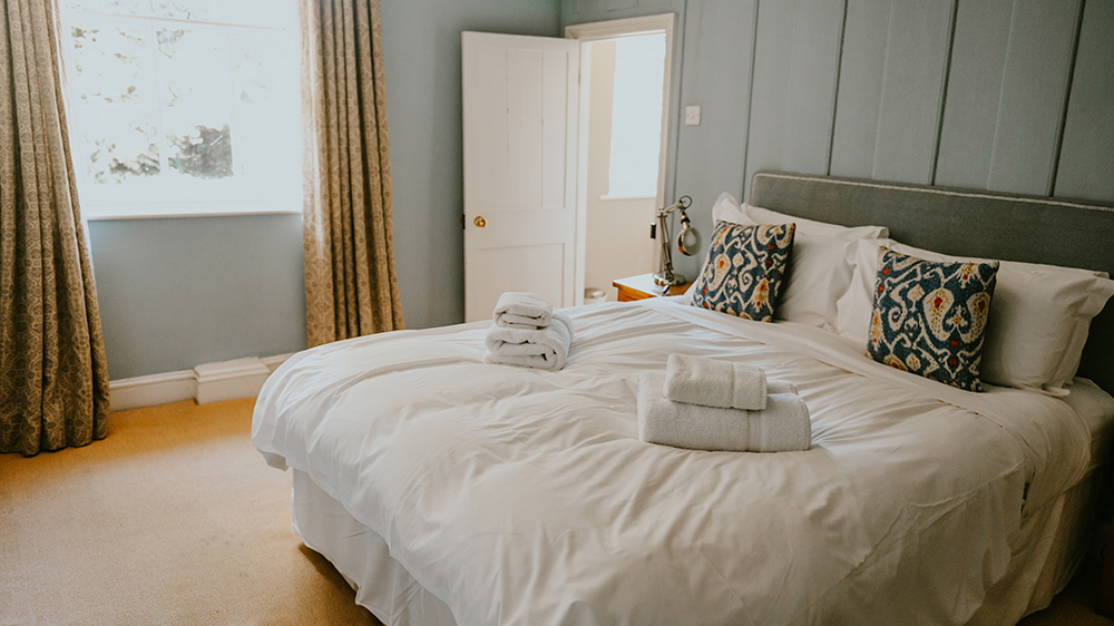 Calm pastels and an ensuite shower in Bedroom 4