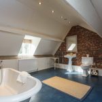 Bedroom 7 ensuite is very spacious with a roll top bath