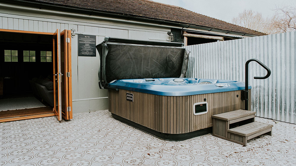 The large hot tub is just outside the games room.