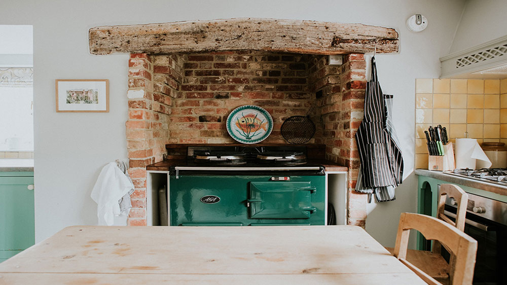 Our big house in Dorset has a country style kitchen with an Aga.