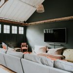 The entertainment zone with wide screen tv and comfy sofas.