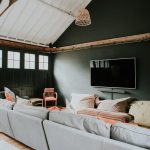 The chill out section of the games room with sofas and wide screen TV