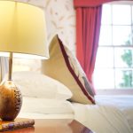 This bedroom has a view over the garden at Tatham House, Somerset