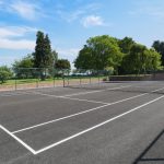 The tennis court is close to the walled garden, hot tub and indoor pool