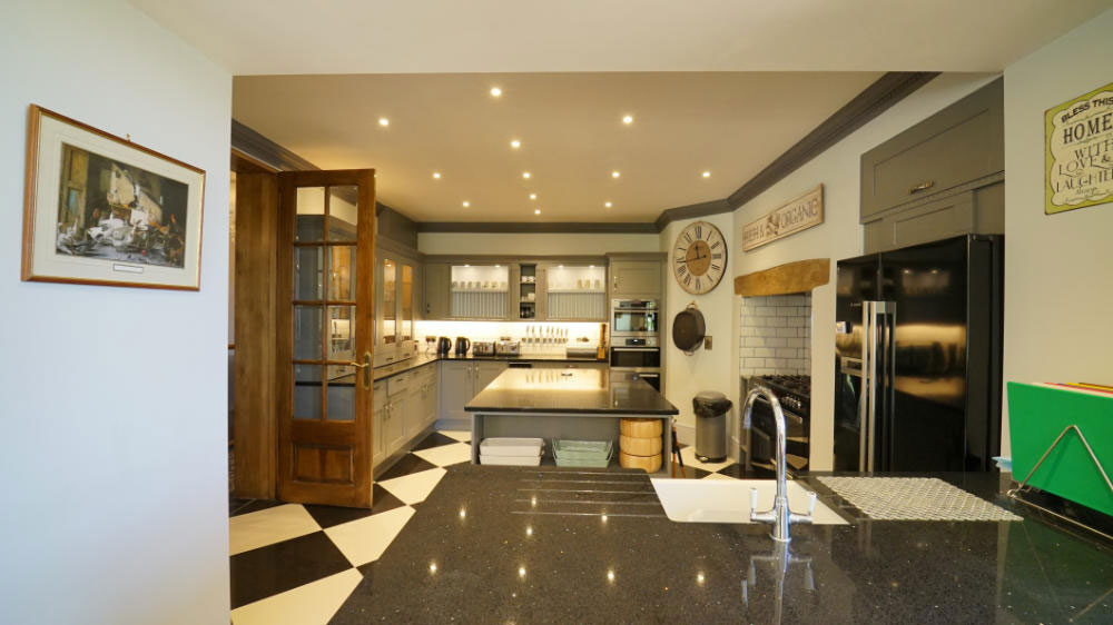 This stylish kitchen has everything needed for a large house party, including a range cooker and 2 dishwashers
