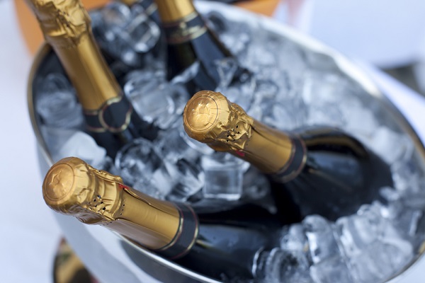 Champagne bottles chilling in an ice bucket for a wedding celebration