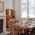 The sunny breakfast room is perfect for a big group of family or friends.