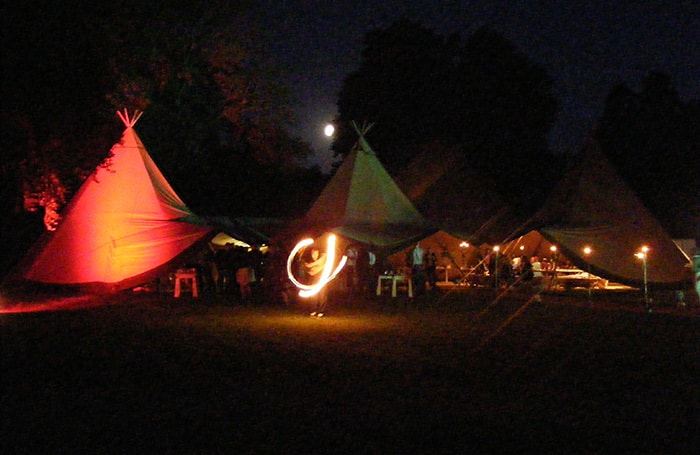 Teepees at night