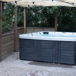 Enjoy the hot tub in a sheltered position in the garden