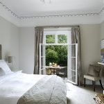 Bedroom 2 is a cosy room with kingsize bed and floor to ceiling windows