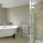 A pretty roll top bath to fill with bubbles plus a shower in this family bathroom