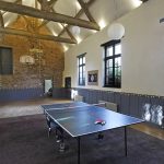 The large games room with table tennis, basketball hoop and plenty of space for dancing after dinner