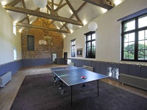 The large games room with table tennis, basketball hoop and plenty of space for dancing after dinner