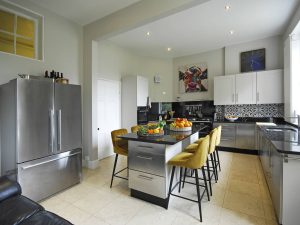 The super stylish kitchen is a social space too, with bar stools for your helpers to perch on