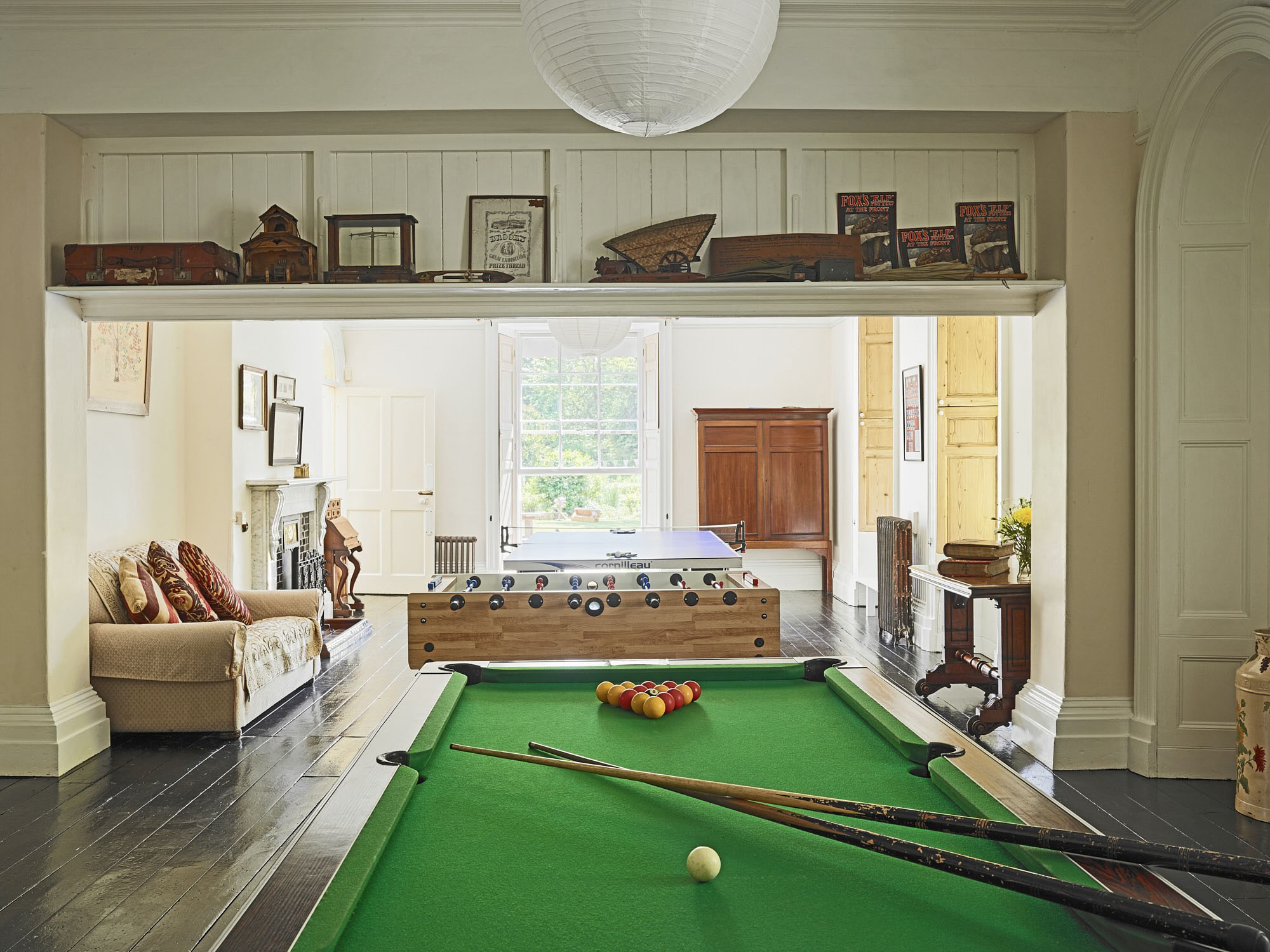 haracterful games room at Tone Dale House featuring a pool table and classic wood panelling — ideal for relaxed evenings.