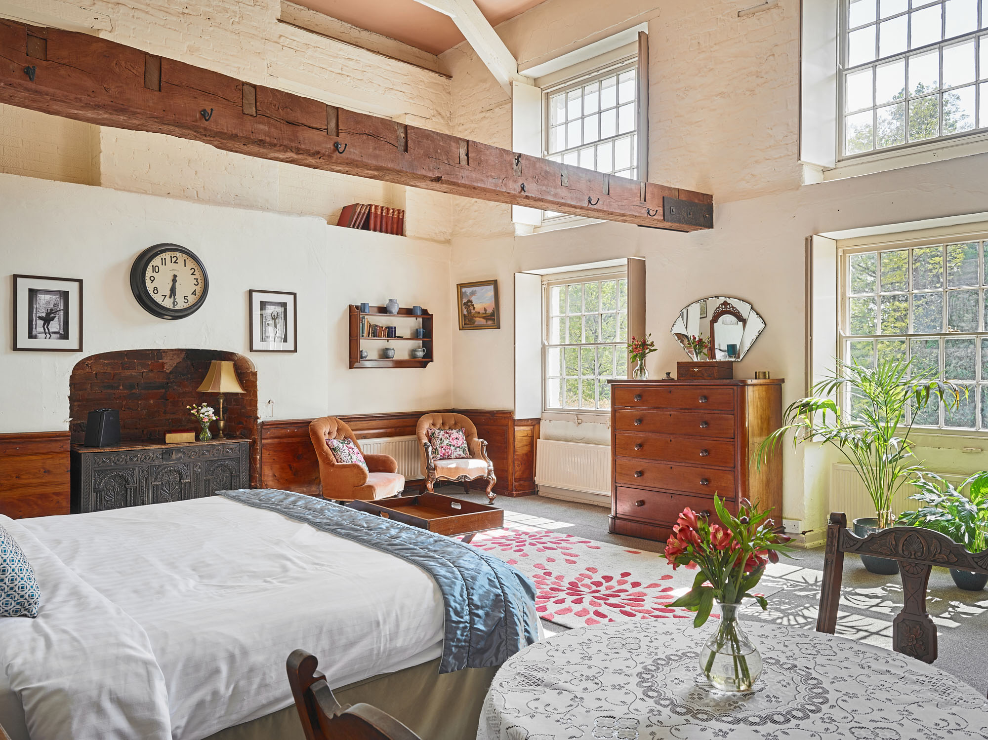 Grand living room at Tone Dale House, Somerset with elegant period décor, large windows and comfortable seating for groups.